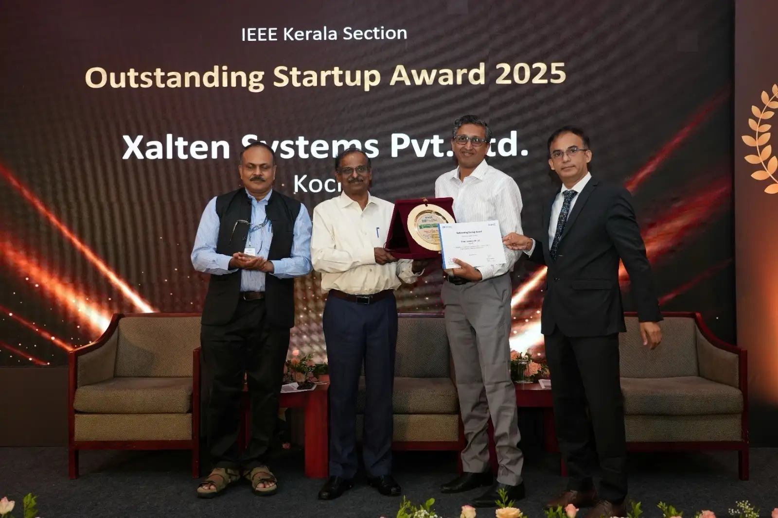 Team Xalten Systems with award plaque